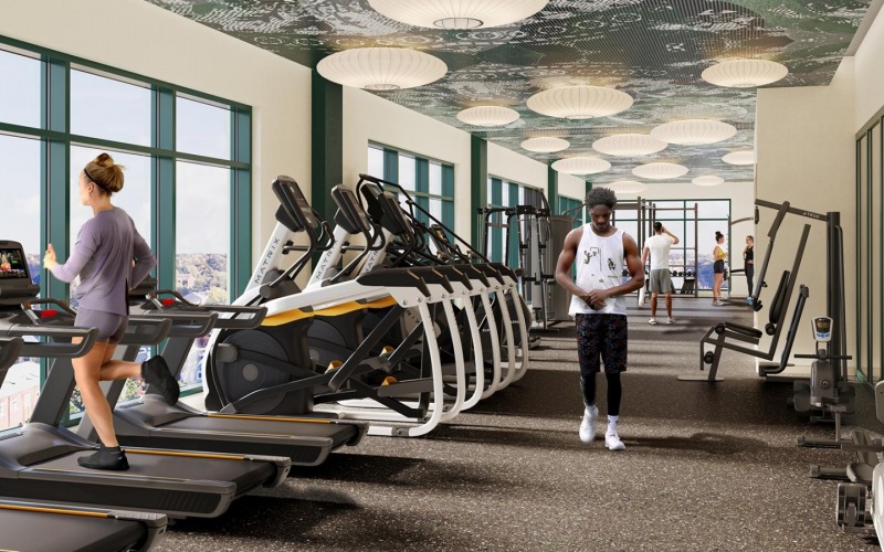 The fitness center at our apartments for rent in Washington DC, featuring treadmills, stair steppers, and spin bikes.